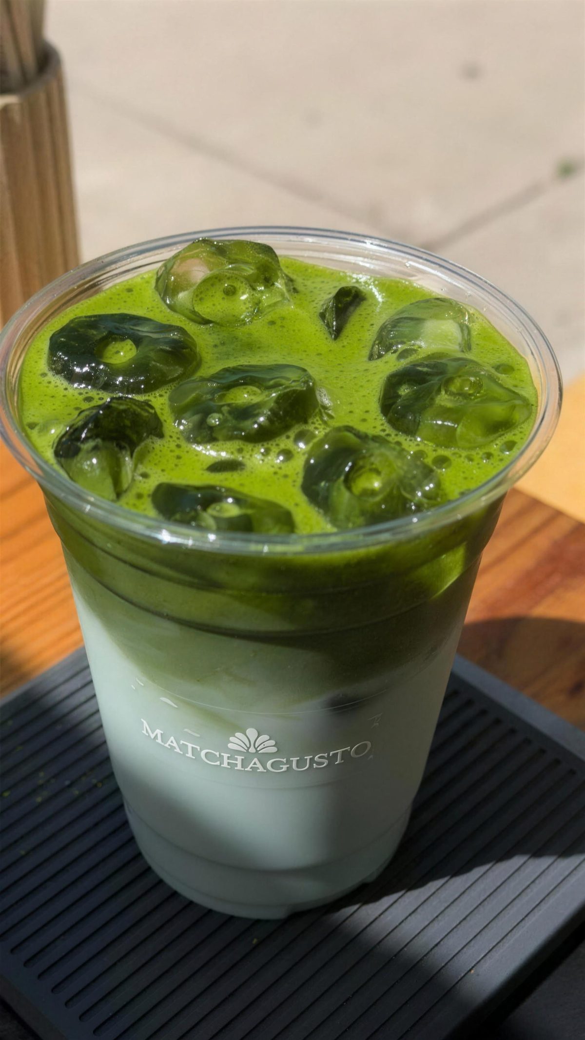Iced matcha latte in a Matcha Gusto cup