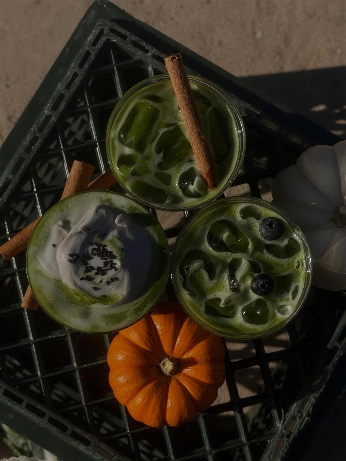 October specials from above: pumpkin horchata with a cinnamon stick, black sesame with sesame cream, and blueberry matcha